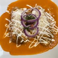 Chiles Rellenos · Stuffed poblano peppers in a tomato sauce.