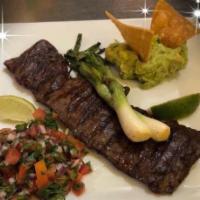 Churrasco Azteca · Skirt steak, pico de gallo, guacamole and bulb onions.