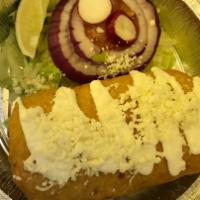 Chimichanga Burritos Carne al Gusto · Deep fried flour tortilla with choice of meat.