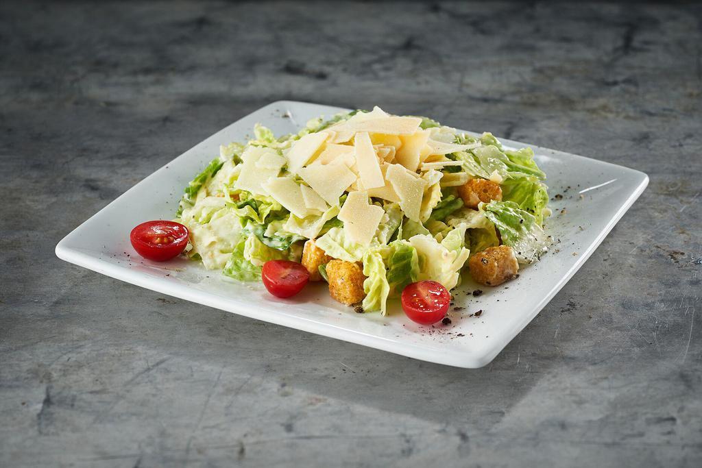 Caesar Salad*  · Fresh romaine hearts, Romano cheese, creamy caesar dressing, shaved parmesan, and fresh ground black pepper.