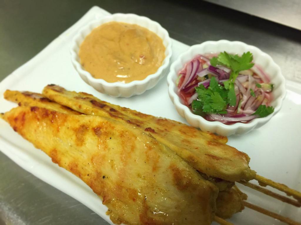 Chicken Satay · 4 pieces. Marinated chicken breast grilled on skewers served with peanut sauce and cucumber salad.