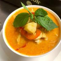 Red Curry · An exotic red curry with coconut milk, bamboo shoots and green and red bell peppers.
