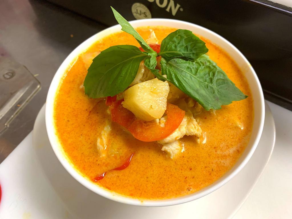 Pineapple Curry · Red chili paste, pineapple, bell peppers, fresh basil and coconuts.