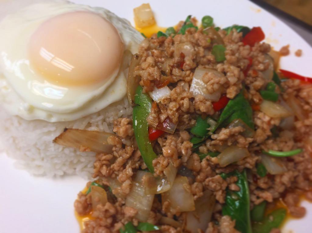 Pad Kra Pao · Original Thai-style basil stir-fry. Choice of minced chicken, minced pork, or tofu. Served with an egg on top and a side of white rice.