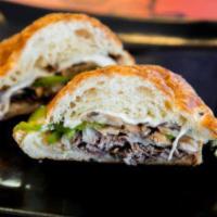 Philly Bastilly Sandwich · Roast beef, provolone, mushrooms, green peppers, and onion.