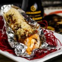 Tour Bus Roll · Spicy tuna, crabmeat and cream cheese. Topped with seared filet mignon, jalapenos, spicy may...