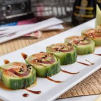 Scorpions Roll · Crabmeat, albacore tuna, red tuna, fresh salmon, yellowtail and avocado. Wrapped with cucumb...