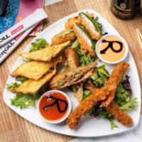Appetizer Sampler · Portions of all our favorites: Famous Crispy Crab Wontons, Egg Rolls, Jalapeno Poppers and T...
