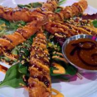 TNT Shrimp · Crispy shrimp served on a bed of spring mix, glazed with sweet
chili sauce, eel sauce and sp...