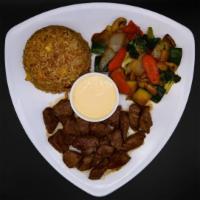 Filet Mignon Hibachi · Grilled filet mignon served with fried rice and vegetables and choice of miso soup or ginger...