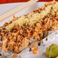 Volcano Roll · California roll (crabmeat, avocado and cucumbers) topped with baked crabmeat, eel sauce, spi...
