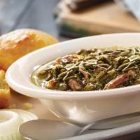 Bowl of Turnip Greens · Turnip Greens simmered with Country Ham and served with an onion slice and vinegar. Served w...