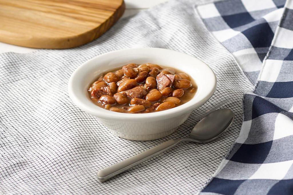 Pinto Beans · Pinto Beans slow simmered with a hint of pork seasoning.

