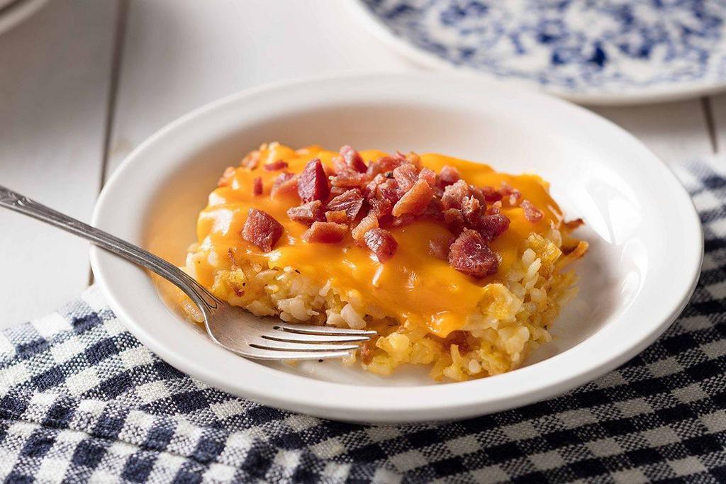 Loaded Hashbrown Casserole · Our Hashbrown Casserole grilled and topped with Colby Cheese, and bacon pieces.

