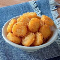 Tater Rounds · Crispy bite-sized potatoes fried ‘til golden.