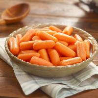 Carrots · Whole baby carrots cooked with a hint of margarine and brown sugar. Packed hot and ready to ...