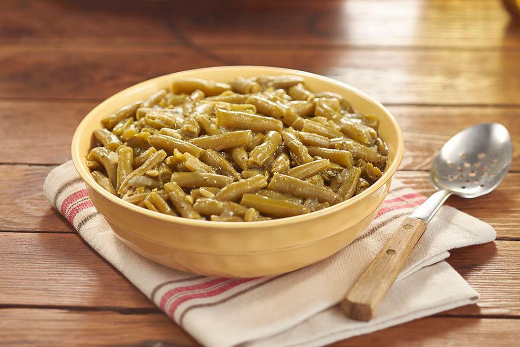 Green Beans  · Greens Beans slow simmered with a hint of pork seasoning. Packed hot and ready to serve. 
