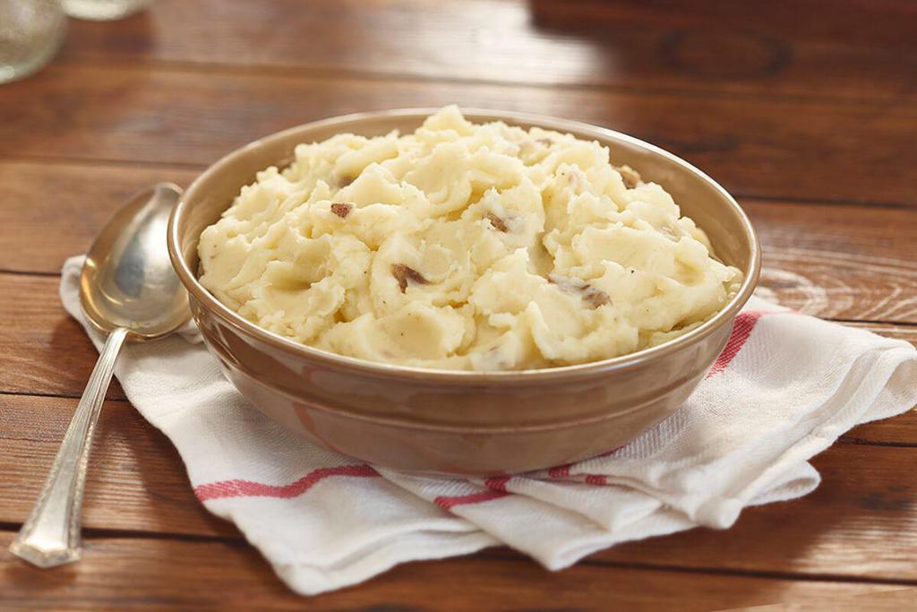 Mashed Potatoes · Creamy Mashed Potatoes with a hint of margarine, Black Pepper and salt. Packed hot and ready to serve
