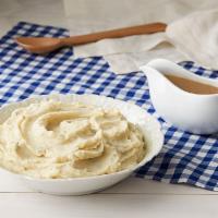 Mashed Potatoes w/Brown Gravy · Creamy Mashed Potatoes with Brown gravy. Packed hot and ready to serve.

