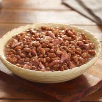 Pinto Beans  · Pinto Beans slow simmered with a hint of pork seasoning. Packed hot and ready to serve.


