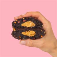 Chocolate Peanut Butter Cup Cookie  · Chocolate peanut butter cup cookie is dark chocolate and is studded with Reese's Pieces and ...