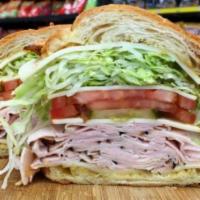 Hot The Mailman Sandwich · Maple glazed honey turkey, Swiss, muenster and provolone cheese with lettuce, tomato, pickle...