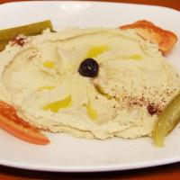 Hummus · Blend of garbanzo beans, garlic, lemon juice, tahini and olive oil. Served with choice of fr...