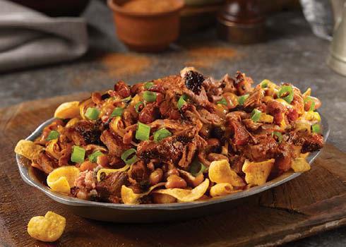 Brisket Chili Frito Pie Stack. · A classic combination of Fritos topped with our Brisket Chili, shredded cheddar cheese, and green onions.