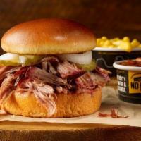 Pulled Pork Sandwich Plate. · Our delicious smoked pork on a brioche bun, served with 2 sides.