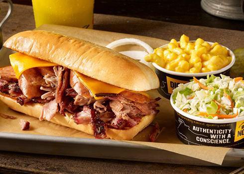 Westerner Sandwich Plate. · Texas sized sandwich, with your choice of two slow-smoked meats and cheddar cheese on a toasted hoagie bun, served with 2 sides.