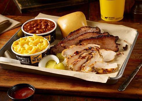 2 Meat Plate · Choose your favorite combination of two slow-smoked meats served with two sides and a roll.