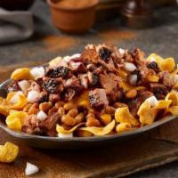 Fritos Pie Stack · Corn chips with your choice of barbecue beans or jalapeno beans and your choice of chopped b...