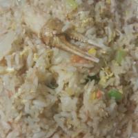 70. Crab Fried Rice · Fried rice with crab meat, crab claws, onions, tomatoes and egg.
