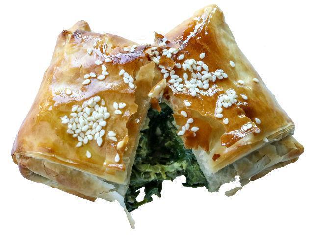 Spanakopita (Spinach Pie) · Baked spinach pie served warm, fresh out of the oven, wrapped in filo with baby spinach, leek, Greek feta cheese, dill, and parsley.