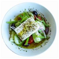 TNG Original Greek Salad · Tomatoes, cucumbers, olives, Greek feta, green peppers and red onion with TNG dressing