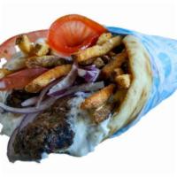 Beef Souvlaki Pita · Grilled fresh beef tenderloin with tomatoes, onion, tzatziki, and fries, wrapped in warm sea...