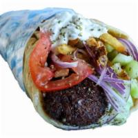 Favalafel Pita · Home-made falafel made with fava beans served with tomatoes, onion, tzatziki, and fries, wra...