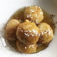 Call Me Fluffy (Loukoumades) · Fried Athenian fluffy mini donuts served warm with Greek thyme honey, cinnamon and powdered ...