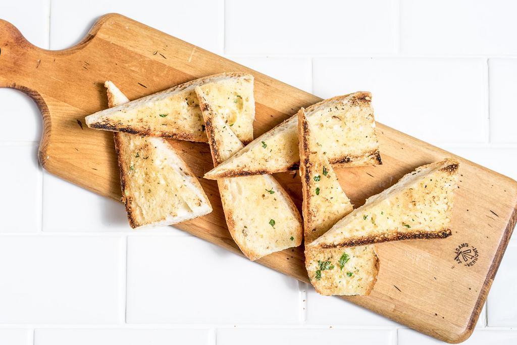 Garlic Bread · Fresh herb-garlic butter.