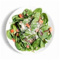 Spinach Salad Balsamico · Roasted balsamic onions, fresh tomato, Parmesan, hazelnuts and balsamic-red wine vinaigrette.