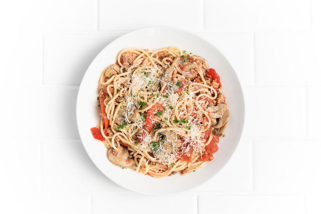 Spaghetti with Spicy Sausage · Crumbled Italian sausage, roasted red peppers, mushrooms, tomatoes, fresh oregano, chili flakes, Parmesan.