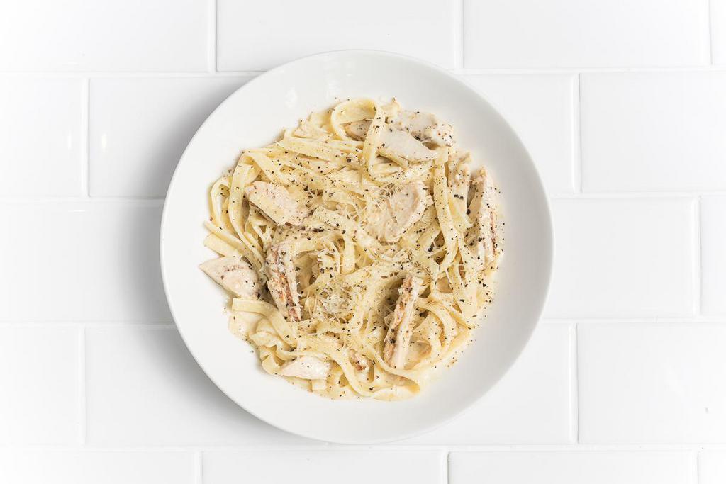 Fettuccini Alfredo with Chicken · Classic Alfredo sauce, cracked black pepper, grated Parmesan.
