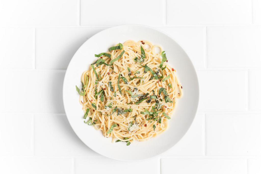 Spaghetti Aglio e Olio · A simple classic with sauteed garlic, olive oil, fresh basil, chili flakes and Parmesan.