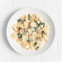 Tortellini Gorgonzola · 3-cheese tortellini, creamy Gorgonzola sauce, diced fresh tomato and spinach and Parmesan.