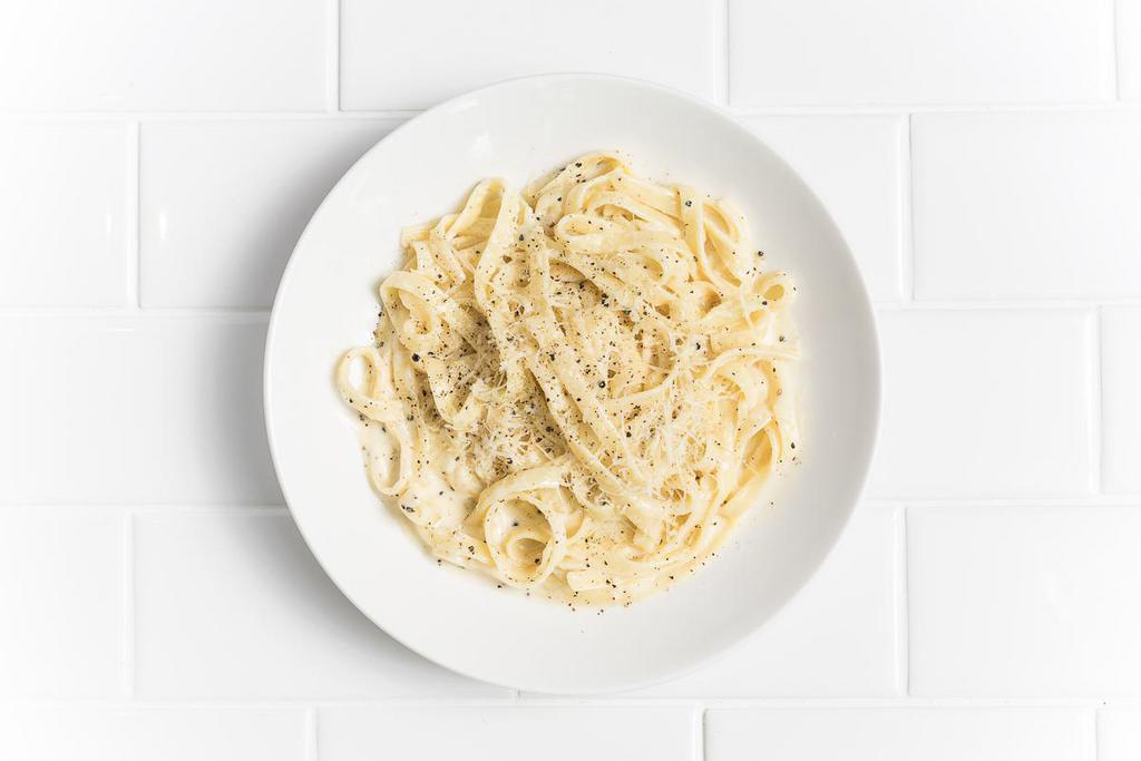 Fettuccini Alfredo · Cream, Parmesan, garlic, butter, cracked black pepper and grated Parmesan.