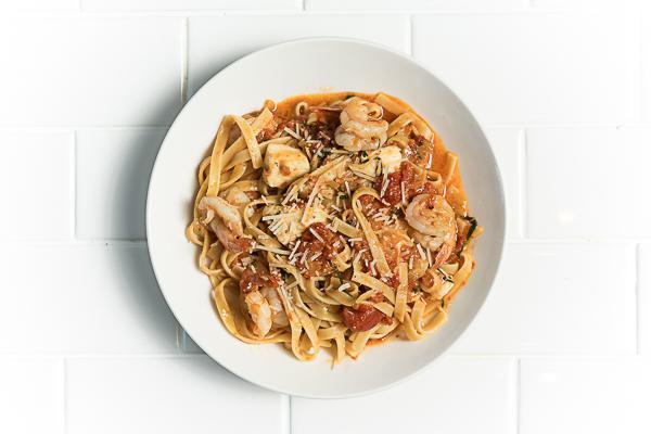 Spicy Shrimp Fettuccini · Lightly spicy tomato-butter sauce, fresh mozzarella, parmesan 
