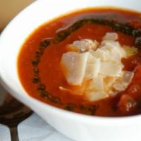 Fresh Tomato Basil Soup · Shaved Romano and drizzled herb oil.