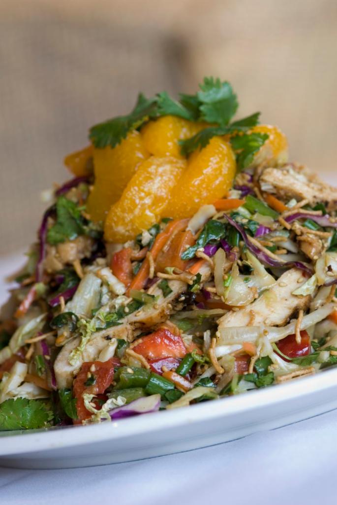 Chinese Chicken Salad · Napa cabbage, bok choy, carrots, bell peppers, sesame seeds, cilantro, scallions, crispy noodles, mandarin oranges and soy Asian dressing.