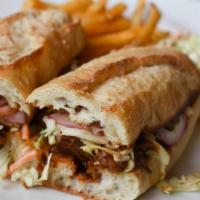 Short Rib Sandwich · Sourdough baguette, BBQ sauce, coleslaw, pickled red onion, served with french fries and col...