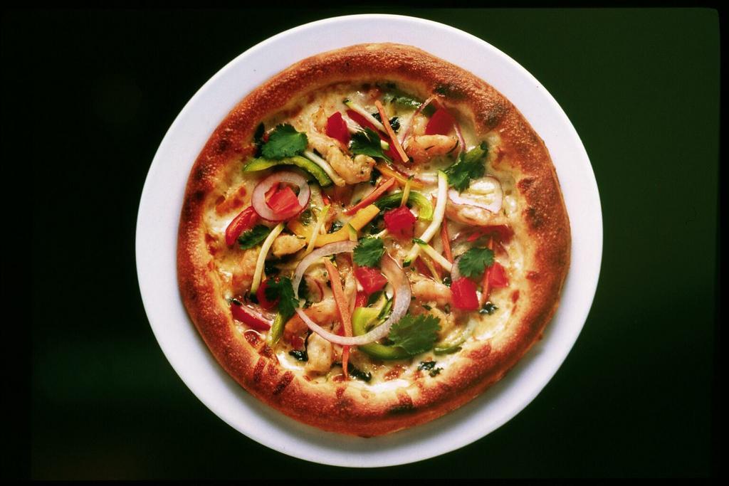 Thai Chicken Pizza · Julienned vegetables, cilantro, scallions, peanuts, lime juice, fresh mint and spicy Thai peanut sauce.
